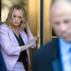 Adult-film actress Stormy Daniels follows her attorney, Michael Avenatti, as she leaves federal court on April 16, 2018, in New York City.
